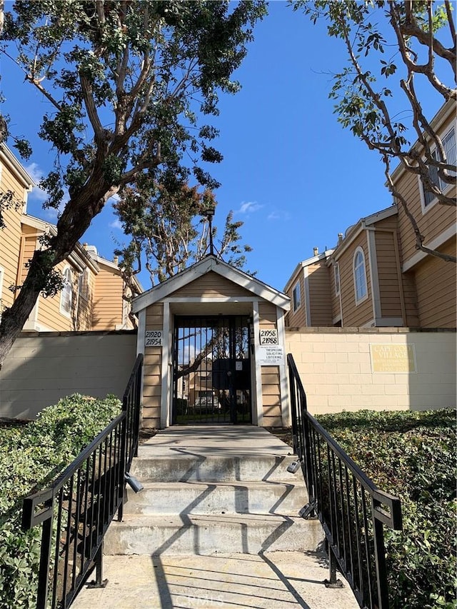 view of exterior entry with fence