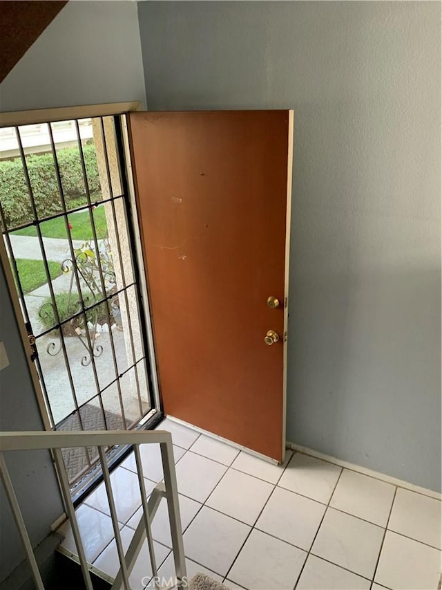 doorway to outside featuring light tile patterned floors