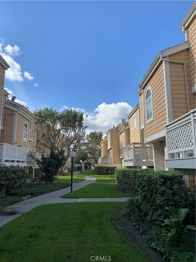 surrounding community featuring a residential view and a yard