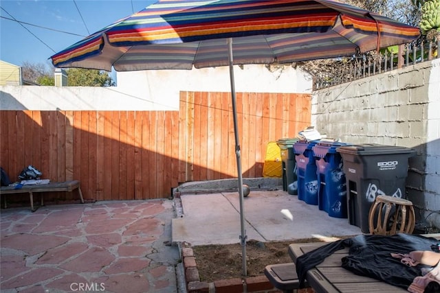 view of patio featuring fence