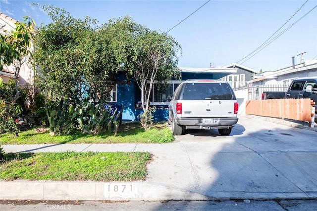 obstructed view of property featuring fence