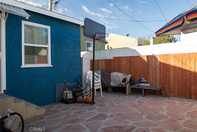 view of patio / terrace featuring fence