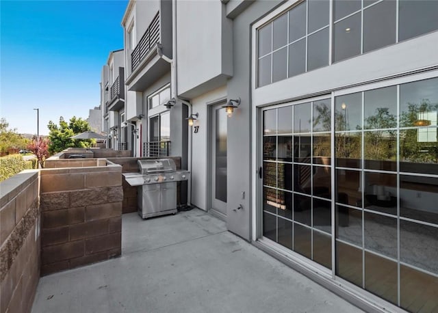 exterior space with a patio area and a grill