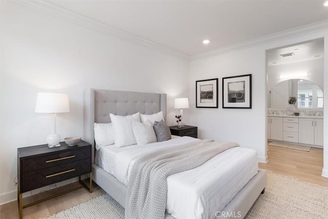 bedroom featuring baseboards, light wood finished floors, recessed lighting, ornamental molding, and connected bathroom