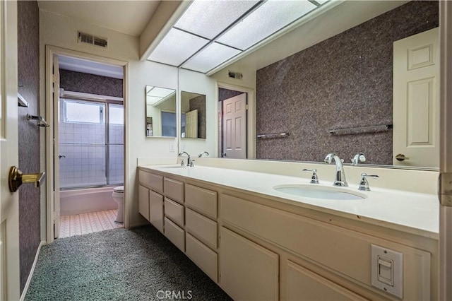 full bathroom with double vanity, visible vents, and a sink