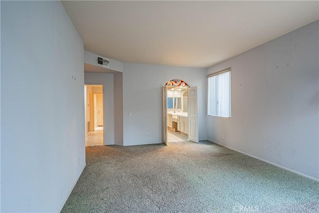 unfurnished room with light carpet and visible vents