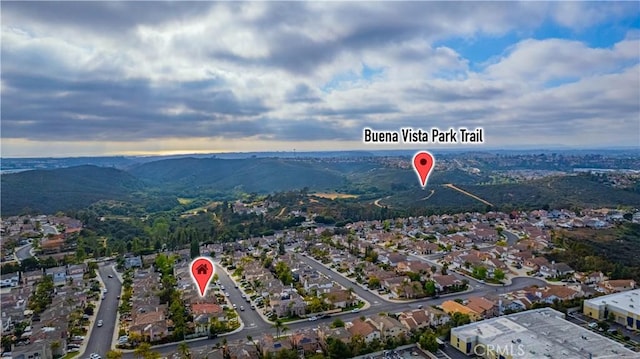 birds eye view of property featuring a residential view and a mountain view