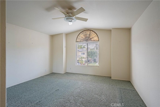 empty room with a ceiling fan and carpet