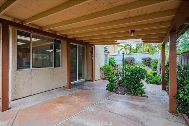 view of patio featuring fence