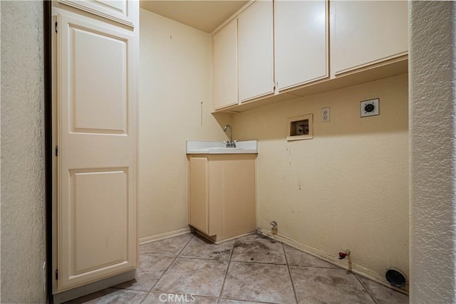 washroom with hookup for a gas dryer, cabinet space, a sink, washer hookup, and hookup for an electric dryer