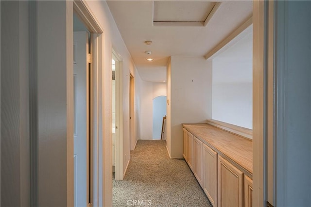 corridor featuring light carpet