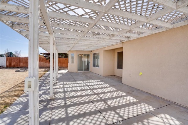 view of patio / terrace featuring fence and a pergola