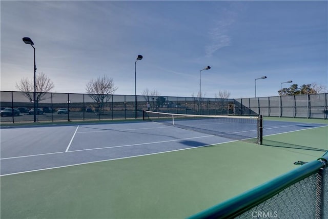 view of tennis court with fence