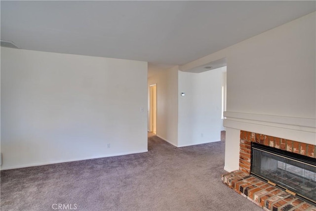 unfurnished living room featuring carpet floors and a fireplace