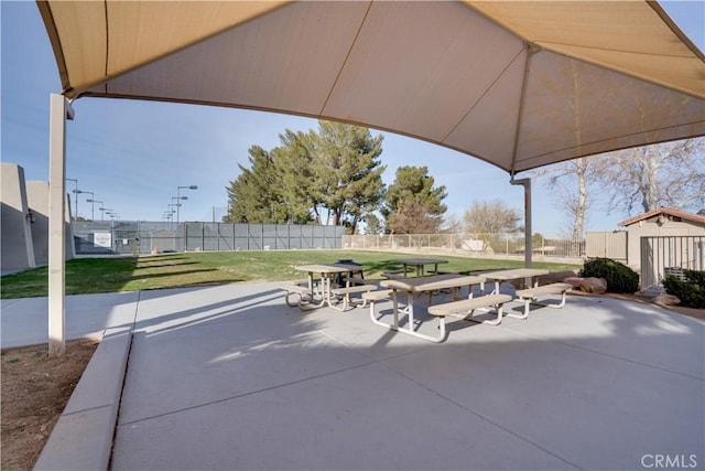 view of patio featuring fence