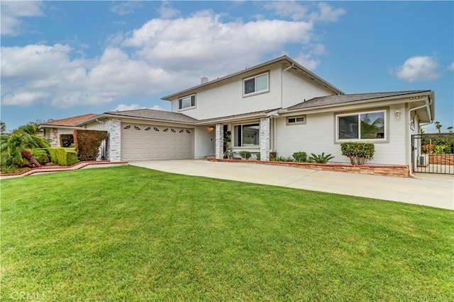 traditional-style home with a front yard, concrete driveway, and an attached garage