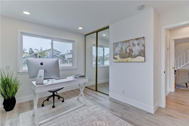 office area featuring light wood-style flooring, baseboards, and recessed lighting