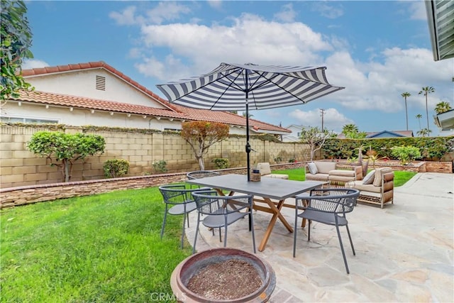 view of patio with an outdoor living space with a fire pit, a fenced backyard, and outdoor dining space