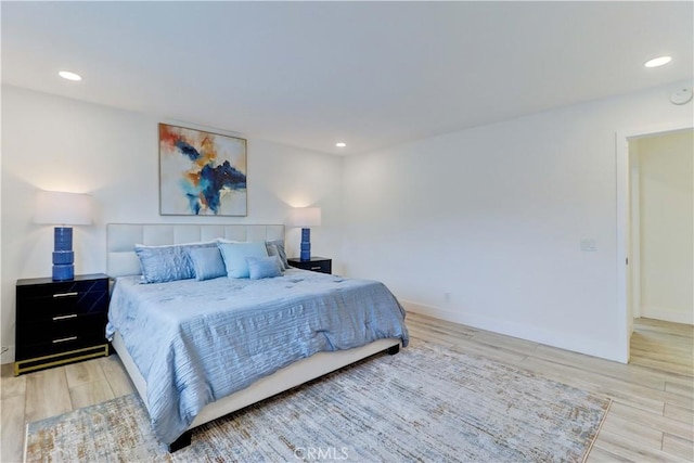 bedroom featuring recessed lighting, baseboards, and wood finished floors