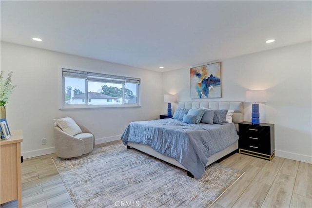 bedroom featuring light wood-type flooring, baseboards, and recessed lighting