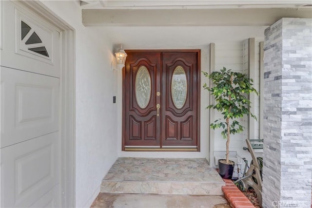 entrance to property with brick siding