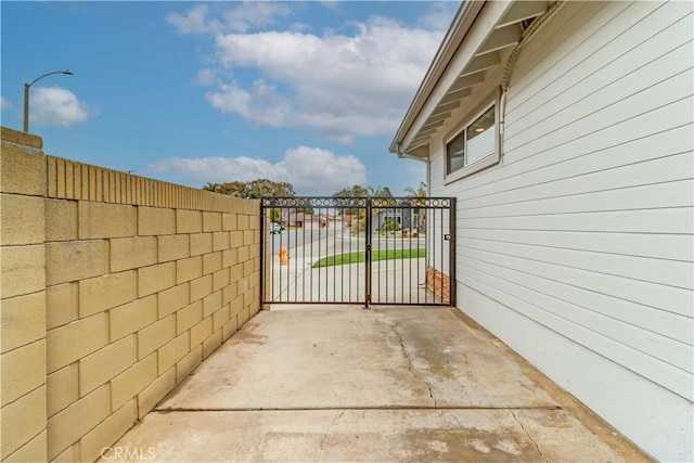 view of gate featuring fence