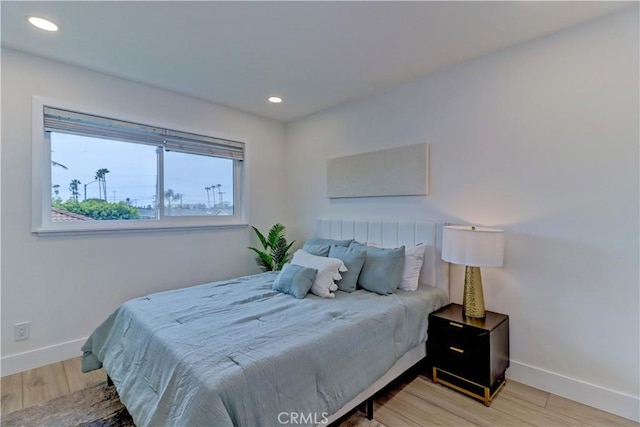 bedroom featuring recessed lighting, baseboards, and wood finished floors