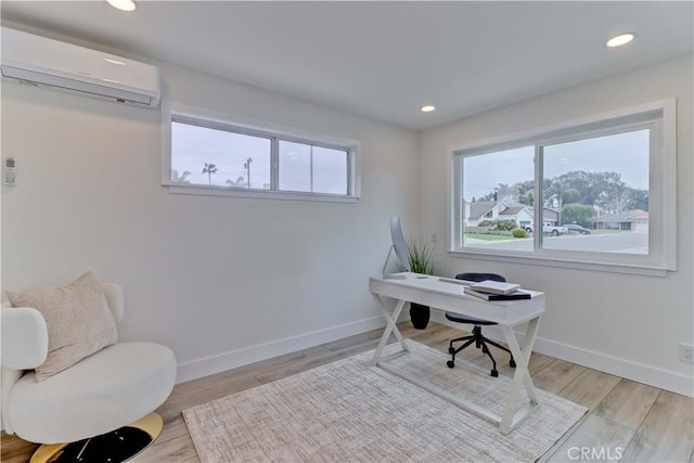 office featuring recessed lighting, baseboards, and a wall mounted AC