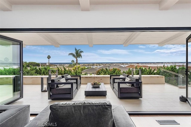 view of patio with outdoor lounge area and visible vents