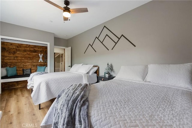 bedroom with wood finished floors and a ceiling fan