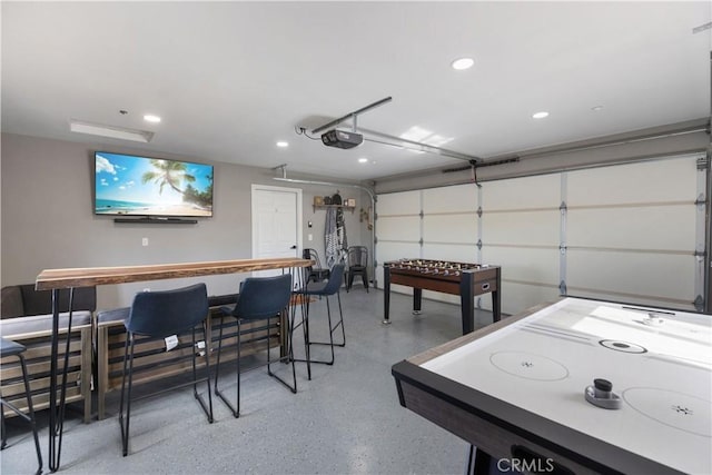 recreation room with a garage and recessed lighting