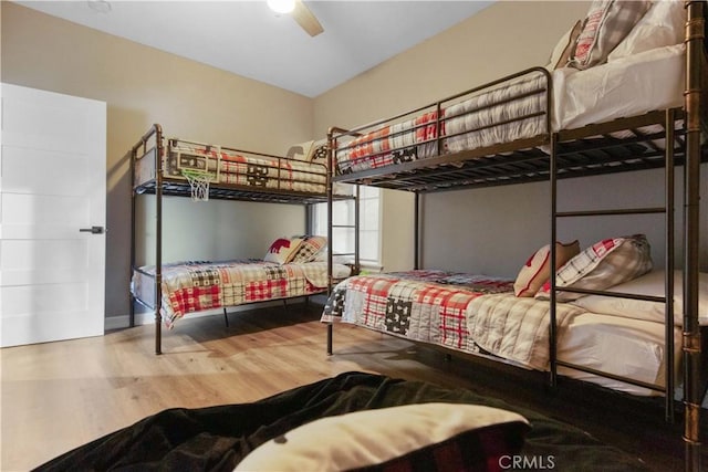 bedroom featuring a ceiling fan and wood finished floors