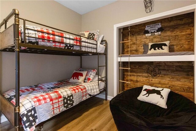 bedroom featuring wood finished floors