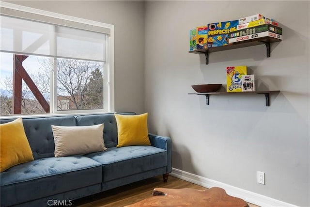 sitting room featuring wood finished floors and baseboards