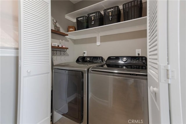 washroom with laundry area and separate washer and dryer