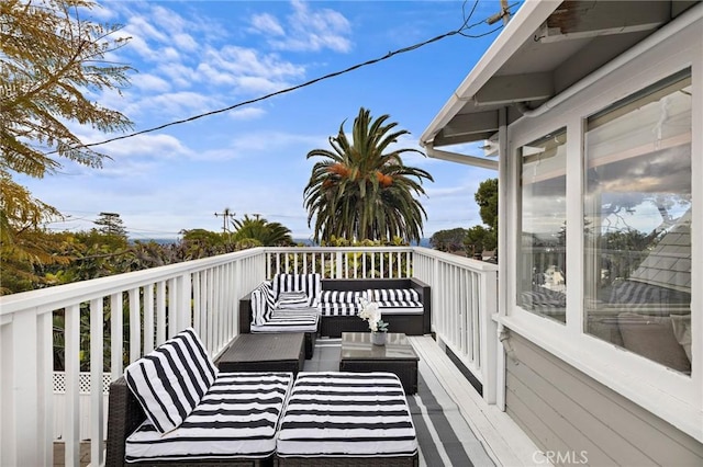 wooden deck with outdoor lounge area