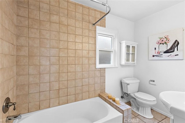 full bathroom featuring  shower combination, toilet, and tile patterned floors