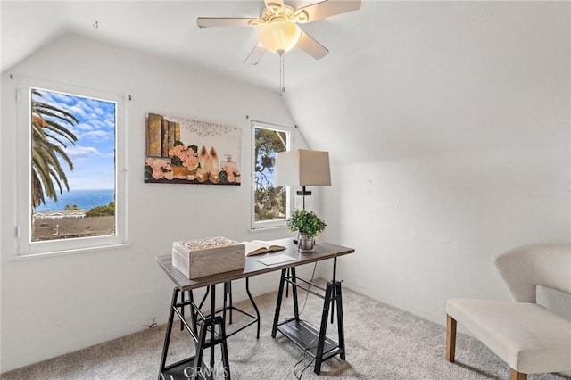 office space featuring light carpet, vaulted ceiling, and ceiling fan