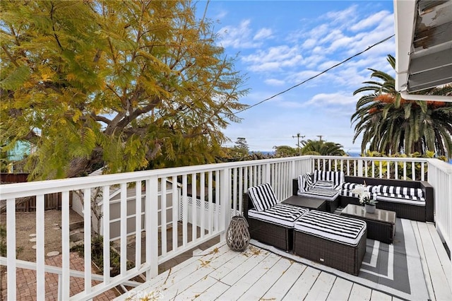 wooden deck featuring an outdoor hangout area