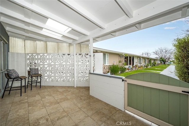 exterior space featuring a gate, fence, and a patio