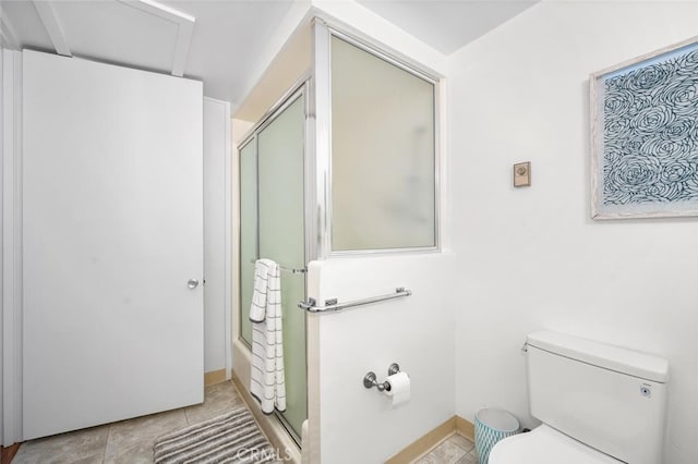 full bathroom with an enclosed shower, toilet, and tile patterned floors