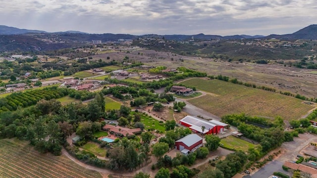 aerial view with a mountain view and a rural view