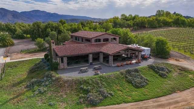 bird's eye view featuring a rural view and a mountain view