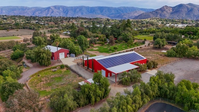 birds eye view of property with a mountain view