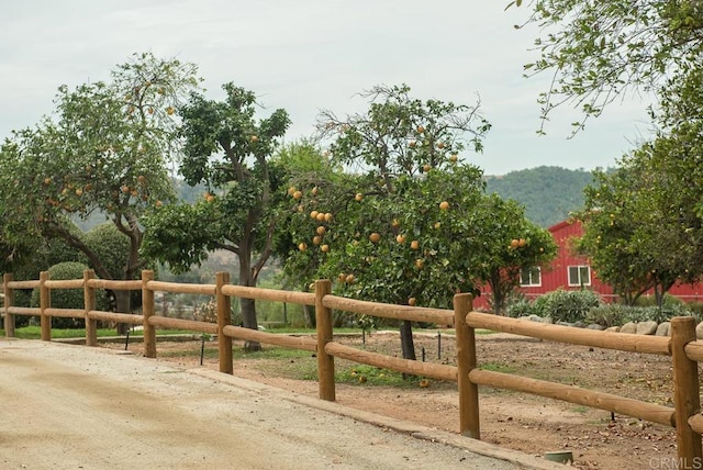 view of gate with fence