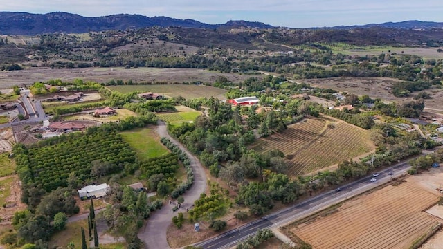 birds eye view of property with a rural view and a mountain view