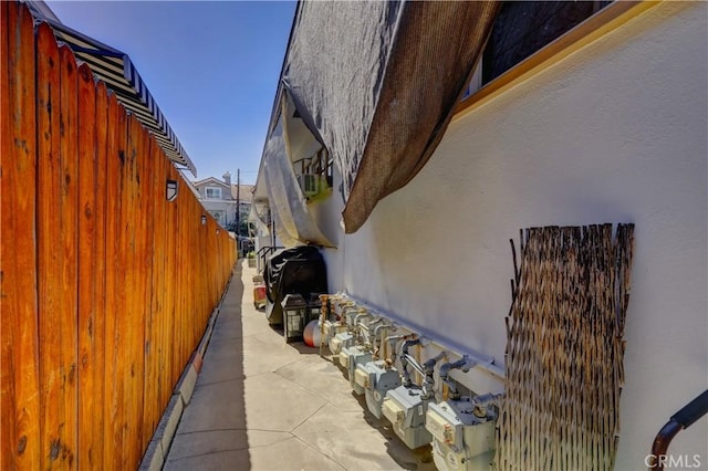 view of home's exterior featuring fence and stucco siding