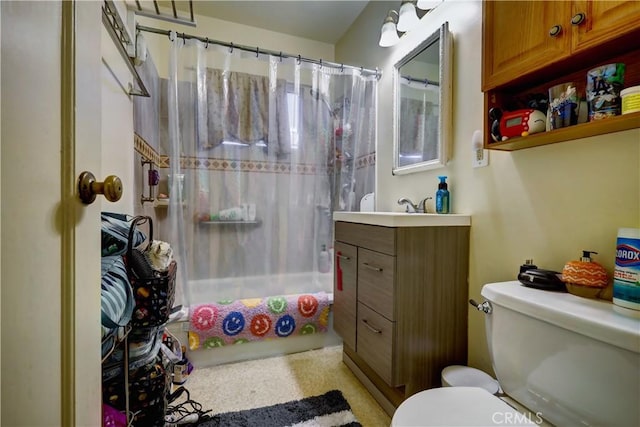 full bath with vanity, shower / bath combo, and toilet