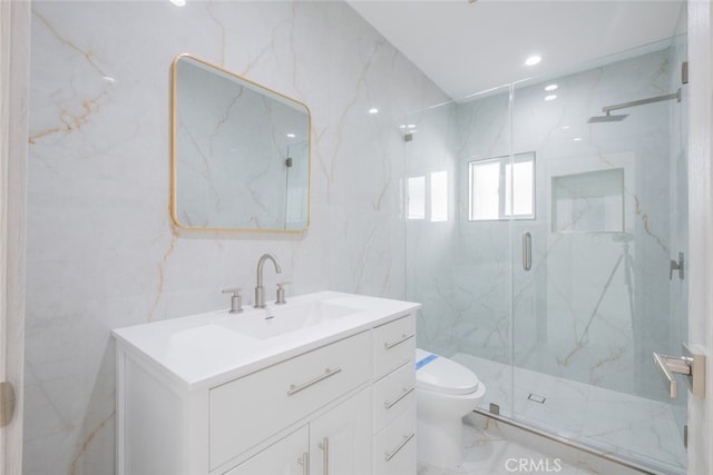 bathroom featuring marble finish floor, tile walls, a marble finish shower, toilet, and vanity