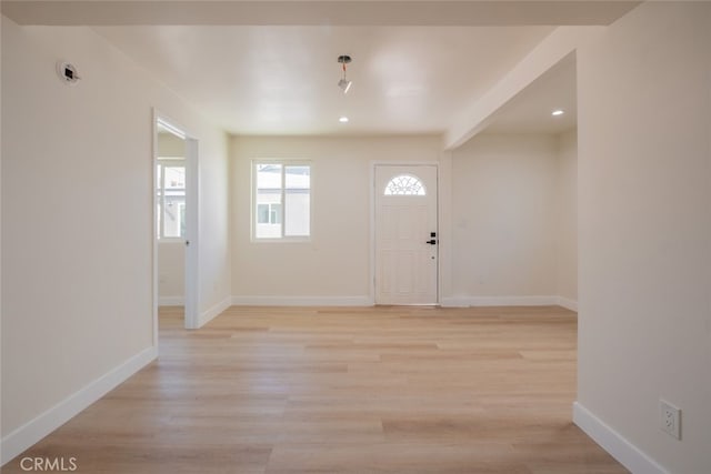 entryway featuring recessed lighting, baseboards, and light wood finished floors